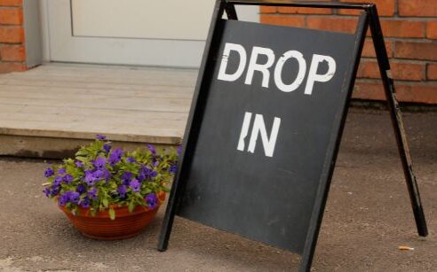 door with drop-in sign