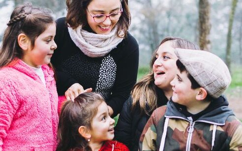 family outside laughing together