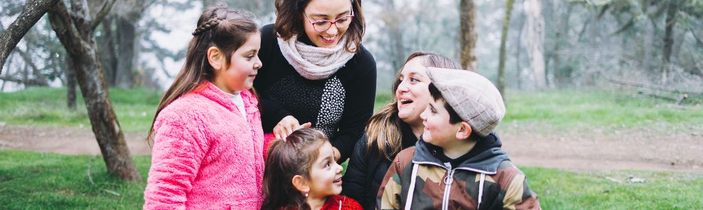 family outside laughing together